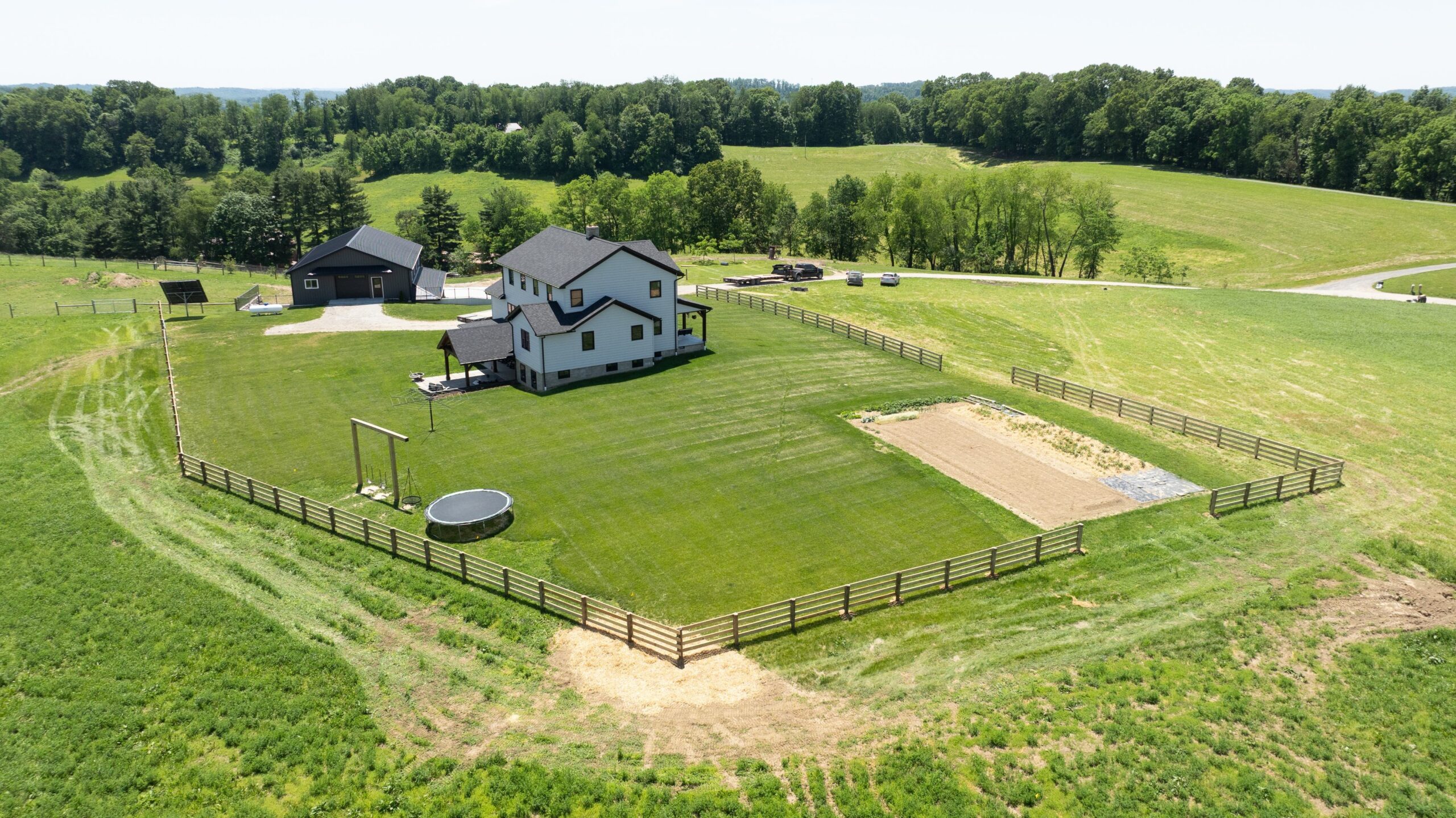 Aerial view of a fenced rural property